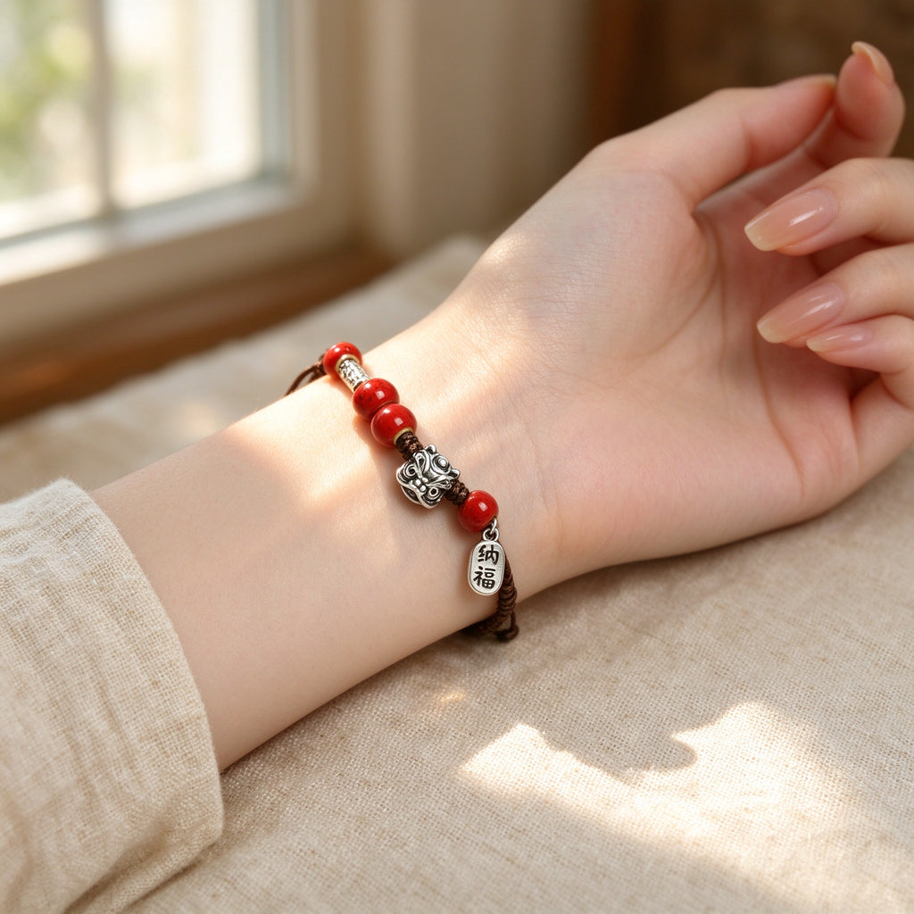 Cinnabar Red Bead Bracelet with Silver Lucky Charms